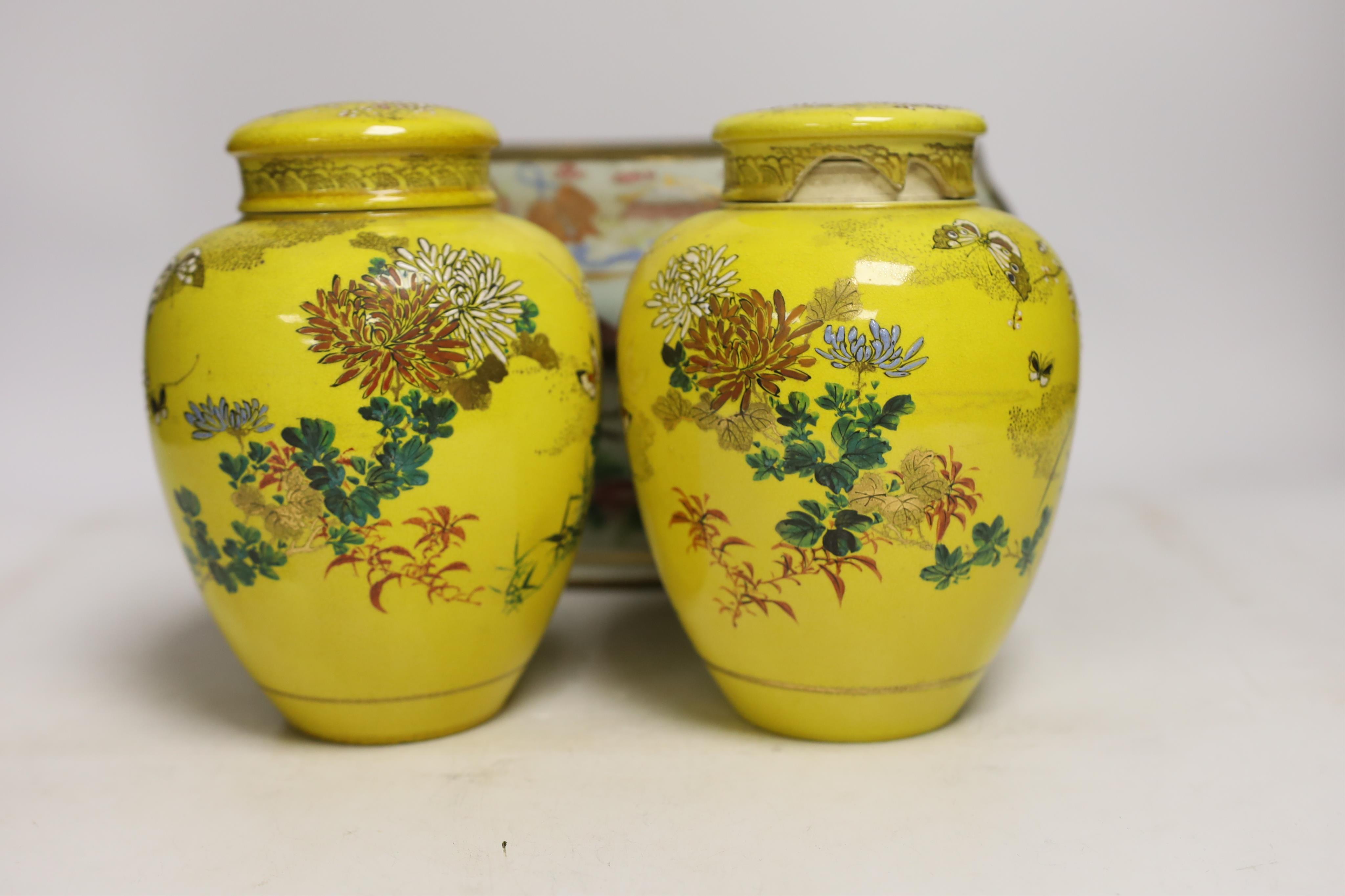 A 19th century Chinese famille rose tureen (lacking cover), a bronze mirror, a brush pot, a crackle glazed teabowl and a pair of Japanese yellow glazed satsuma jars and covers, tallest 18cm (6)